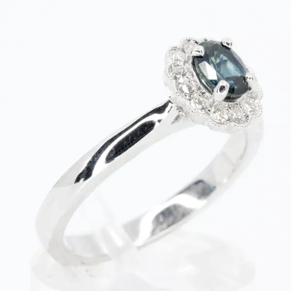 Oval Shape Australian Sapphire Ring with Grain of Diamonds Set in 18ct White Gold