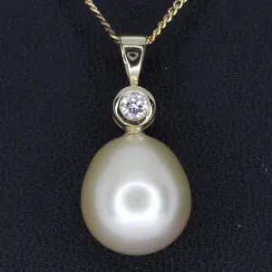 golden south sea pearl pendant with diamonds