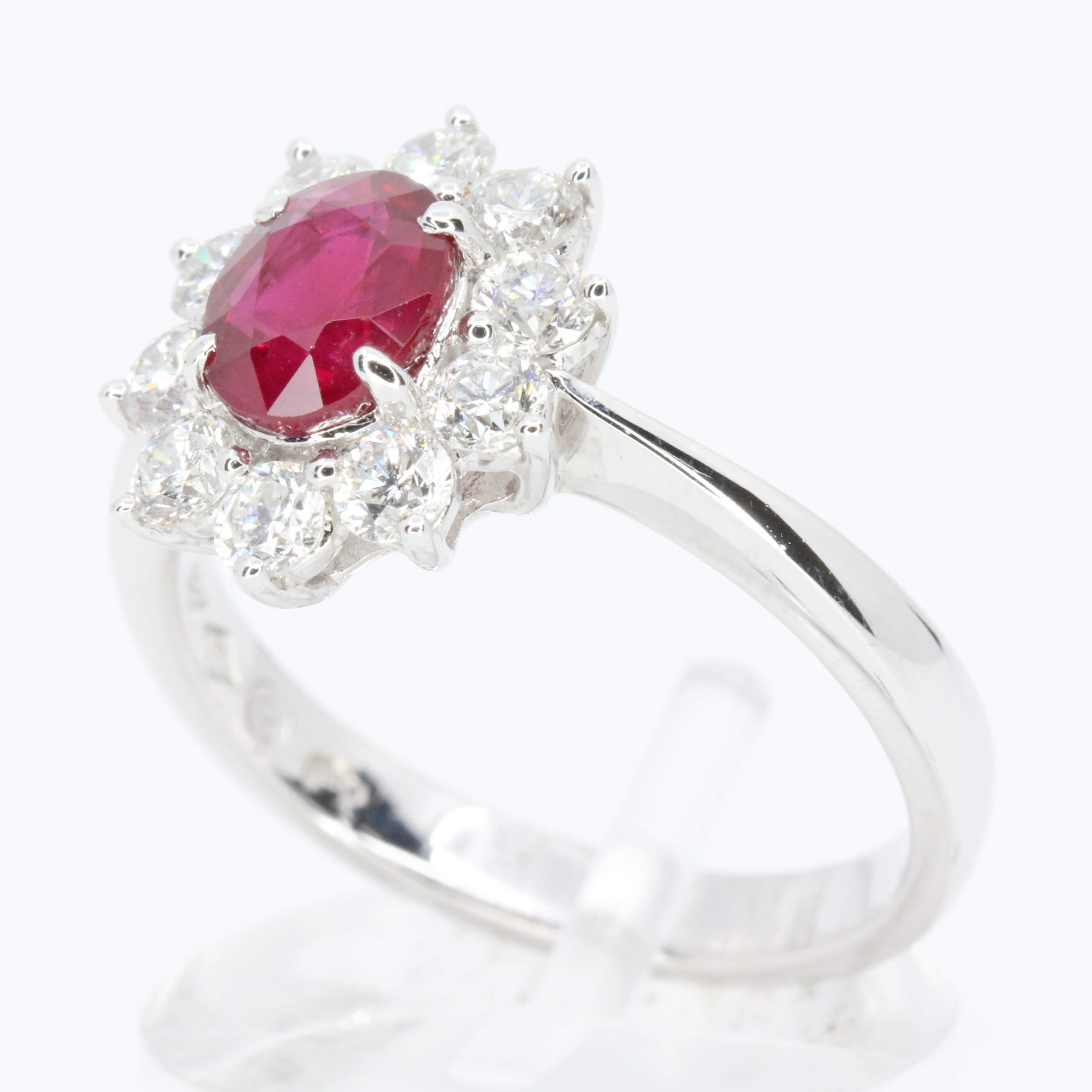 Oval Cut Ruby Ring with Diamond Halo Set in 18ct White Gold Size M